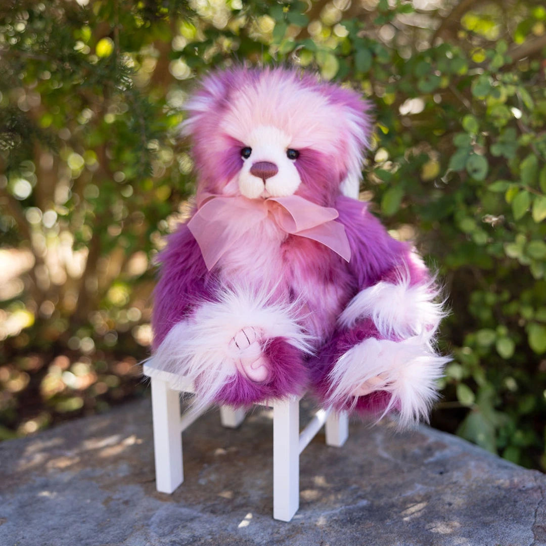 Rose Moon, 15" Charlie Bear Plush Teddy Bear sitting in a white chair